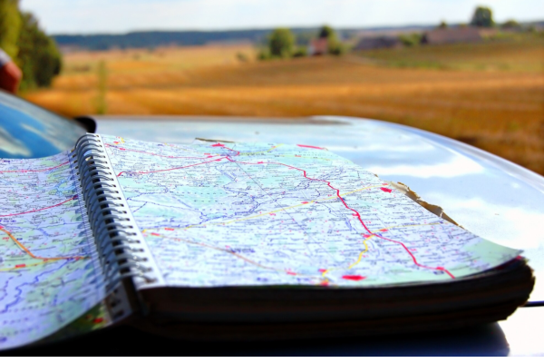 Renting a car in Morocco for a scenic road trip with DL CARS, showcasing top destinations like the Sahara Desert, Marrakech, and Atlas Mountains.