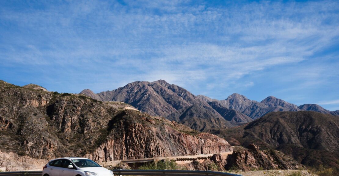 Tourist driving a DL CARS rental vehicle in the Moroccan desert