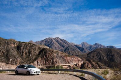 Tourist driving a DL CARS rental vehicle in the Moroccan desert
