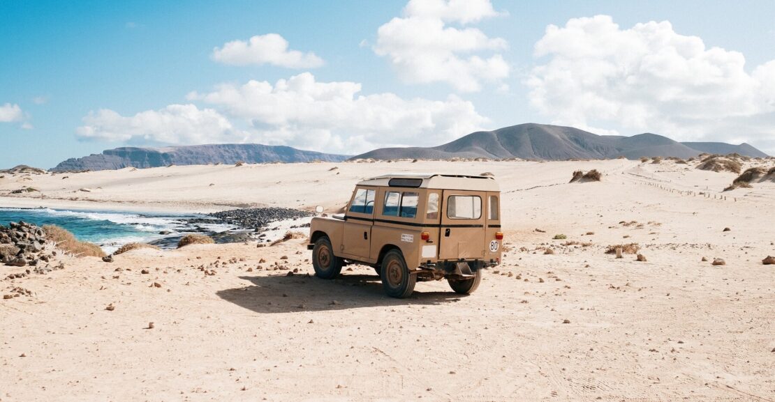 A 4x4 vehicle driving through the Moroccan desert, perfect for off-road adventures.