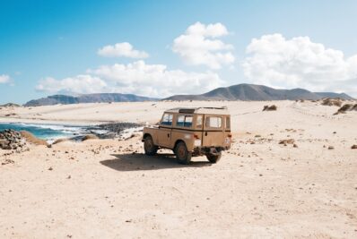 A 4x4 vehicle driving through the Moroccan desert, perfect for off-road adventures.